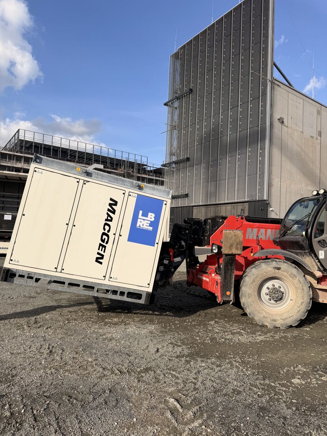 Load bank being positioned on a data-centre construction site in Frankfurt