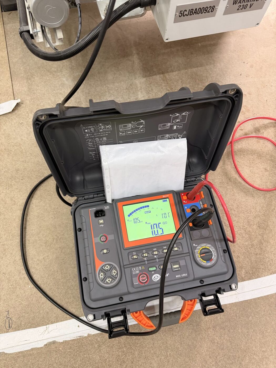 High-voltage insulation resistance tester showing a test result