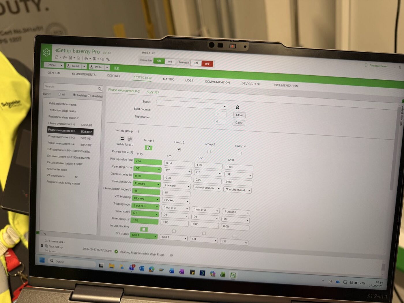Protection relay settings being configured on a laptop